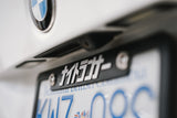 TWO NRI PLATE FRAMES